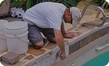 Piscinas D'Martinez technician working on a pool